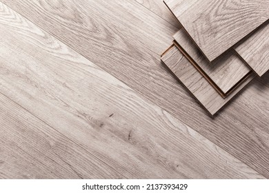 Laminate wood floor background texture. Wooden laminate stack with copy space - Shutterstock ID 2137393429