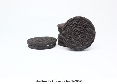 LAMONGAN, INDONESIA – June 06, 2022: Biscuit Sandwich Oreos Cookies Isolated On White Background With Vanilla Milk Chocolate Cream Which Is Split And Bitten With Oreo Crumbs Sprinkle Lined Up Neatly