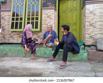 Lamongan, Indonesia - June 3, 2021: Teenage Couple Talking To Parents In Lamongan, Indonesia On June 3, 2021