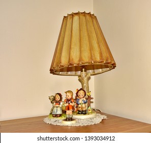 Lamp With Hummel Figurines And Original Shade, Huddersfield Yorkshire England 09/05/2019