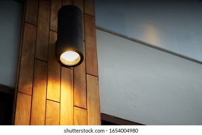 lamp on wooden tile decoration pole with turn on light in dark time - Powered by Shutterstock