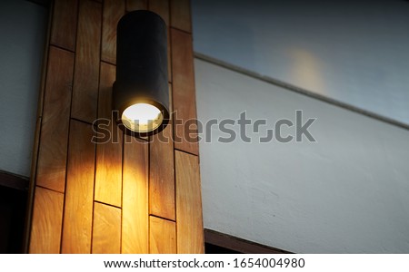 lamp on wooden tile decoration pole with turn on light in dark time