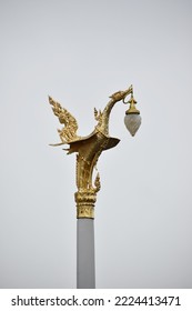 Lamp post. A vintage thai lighting pole of a beautiful swan or kinnaree, Thai mytical creature, at Thai temple decorative in blue and white against the bright blue sky. Copy space  soft focus.