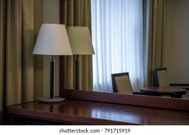 the lamp reflected in the mirror