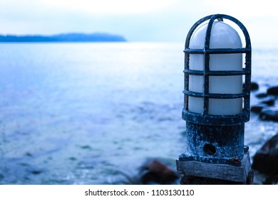 A lamp without light by the sea