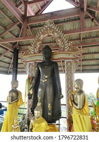 Lampang / Thailand: 25 July 2020: Big Buddha image in standing position at Wat Phra Phutthabat Pu Pha Daeng, Lampang, Thailand