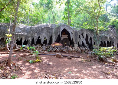Lampang, Thailand - July 5, 2018: Rock looks like a cave at Wat Chaloem Phra Kiat Phrachomklao Rachanusorn or Wat Phrabat Pu Phadaeng located on Doi Pu Yak unseen place in Chae Hom District.


