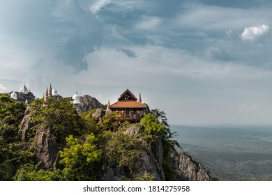 Lampang, Thailand - Sep 03, 2020 : Pagoda on top of the cliff high mountain at Chaloem Phrakiat Phrachomklao Rachanuson temple (Wat Phrabat Pu Pha Daeng). Unseen and Amazing temple in Thailand.