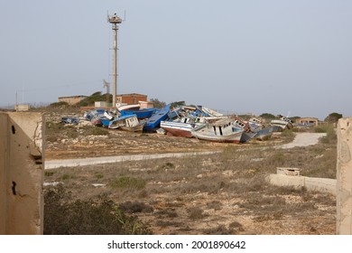 Lampedusa, Italia July 2, 2021, Several Boats Used By Migrants To Cross The Mediterranean Between North Africa And The Italian Island Of Lampedusa Are Abandoned In A 'boat Cemetery'. 