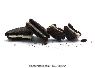 LAMPHUN, THAILAND - JANUARY 6, 2020: Oreo Biscuits with broken and crumbs isolated on white background. It is a sandwich chocolate cookies with a sweet cream is the best selling dessert in Thailand. 