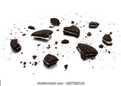 LAMPHUN, THAILAND - JANUARY 6, 2020: Oreo Biscuits with crumbs isolated on white background. It is a chocolate sandwich cookies filled with sweet cream flavored. The best selling dessert in Thailand.