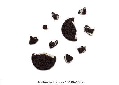 LAMPHUN, THAILAND - JULY 4, 2019: Oreo Biscuits with crumbs isolated on white background. It is a sandwich cookies filled with chocolate cream flavored. The best selling dessert in Thailand.