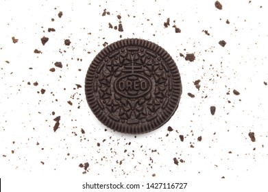 LAMPHUN, THAILAND - JUNE 18, 2019: Oreo Biscuits with crumbs on white background. It is a sandwich chocolate cookies with a sweet cream is the best selling dessert in Thailand. 