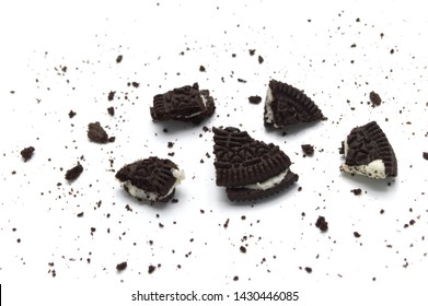 LAMPHUN, THAILAND - JUNE 21, 2019: Oreo Biscuits with crumbs on white background. It is a sandwich chocolate cookies with a sweet cream is the best selling dessert in Thailand. 