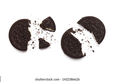 LAMPHUN, THAILAND - JUNE 24, 2019: Oreo Biscuits with crumbs on white background. It is a sandwich chocolate cookies with a sweet cream is the best selling dessert in Thailand. 