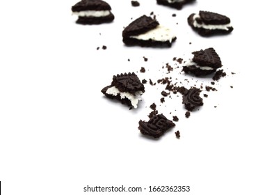 LAMPHUN, THAILAND - MARCH 3, 2020: Oreo Biscuits with crumbs on white background. It is a chocolate sandwich cookies with vanilla flavored cream.