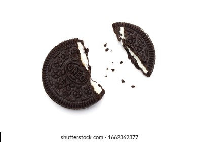 LAMPHUN, THAILAND - MARCH 3, 2020: Oreo Biscuits with crumbs on white background. It is a sandwich cookies filled with chocolate cream flavored. The best selling dessert in Thailand.