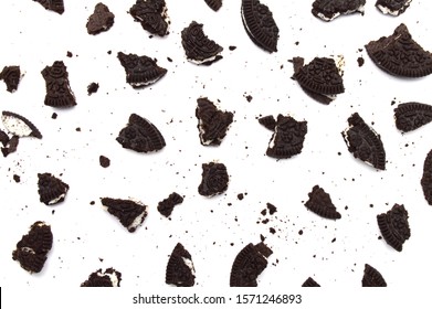 LAMPHUN, THAILAND - NOVEMBER 26, 2019: Oreo Biscuits with cracked and crumbs on white background. It is a sandwich cookies filled with sweet cream flavored is the best selling dessert in Thailand.  