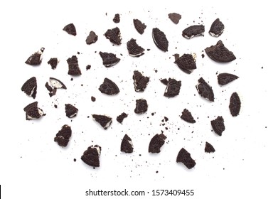 LAMPHUN, THAILAND - NOVEMBER 26, 2019: Oreo Biscuits With Cracked And Crumbs On White Background. It Is A Sandwich Cookies Filled With Sweet Cream Flavored Is The Best Selling Dessert In Thailand.  