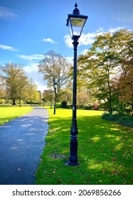Lampost and path in park on autumn day