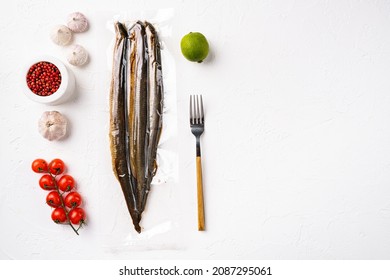 Lamprey in plastic pack set, on white stone table background, top view flat lay, with copy space for text
