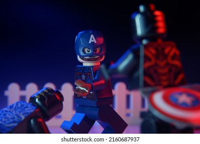 Lampung, Indonesia: May 23 2022, Lego Captain America defeat chitauri with his shield. exposed by blue light and red light from side. Lego minigures are made by the le