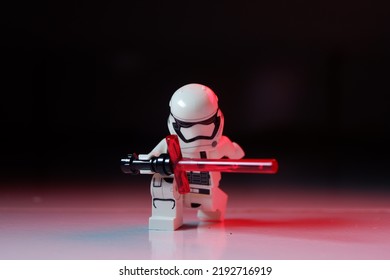 Lampung, Indonesia: May 27 2022 Storm Trooper Learn To Use Red Light Saber And The Force At Night In Dark. Lego Minifigure Are Made By The Lego Group