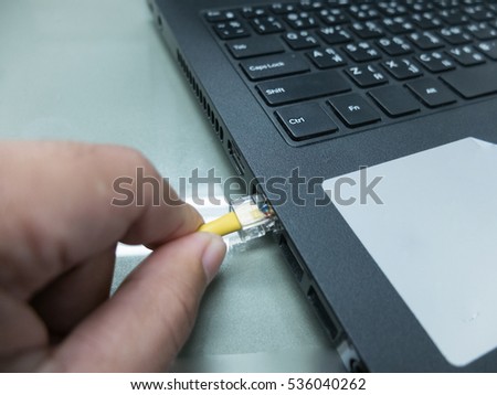 Lan cable connect to computer. Network connecting to  the internet.