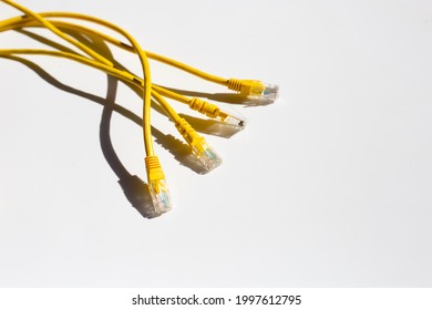 LAN network connection ethernet yellow cables on white