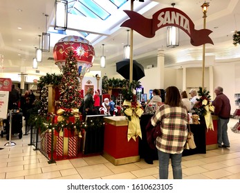 Lancaster, Ohio, Dec. 22, 2019: People Wait In Line To Get Their Children's Pictures Taken With A Mall Santa Claus.