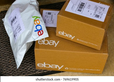 Lancaster, PA, USA - December 4, 2017: Multiple ebay packages delivered to a residential front door.