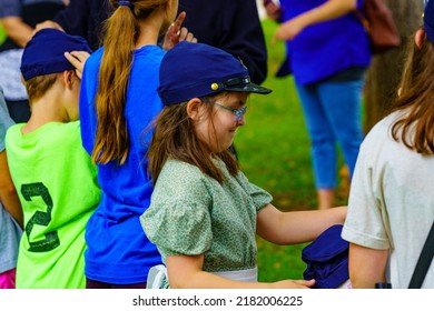 Lancaster, PA, USA – July 16, 2022: A Young Girl Learning About The Union Army At The Landis Valley Farm Museum During The Civil War Weekend Event.