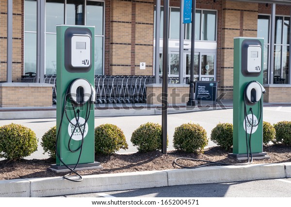 Lancaster, Pennsylvania,\
USA, February 19, 2020: Electric car charging station outside local\
grocery store.