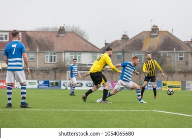 Lancing, England; 25th March 2018; Action Shots, Sunday League Amatur Football Match Between Hillside Rangers FC And AFC Beavers FC. Player Stretches For Ball