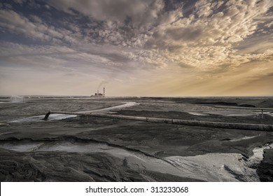 A Land Of Ash. Hundreds Of Square Miles Covered With Lifeless Ash. Ash Waste Is Produced By Burned Coal In A Power Plant. 