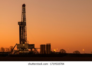 Land based oil and gas drill rig in sunset