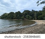 Land Between the Lakes National Recreation Area, Kentucky, USA - September 1, 2024: Remote and rocky beach at the end of a trail in the recreation area. 