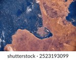 Land features in the area of Sparmurat Turkmenbashy,Turkmenistan. Digital enhancement of an image by NASA