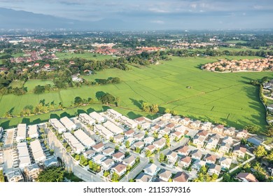 Land Or Landscape Of Green Field In Aerial View. Include Agriculture Farm, House Building, Village. That Real Estate Or Property. Plot Of Land To Housing Subdivision, Development, Sale Or Investment.
