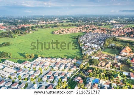 Land or landscape of green field in aerial view. Include agriculture farm, house building, village. That real estate or property. Plot of land to sale, rent, buy mortgage or investment in Chiang Mai.