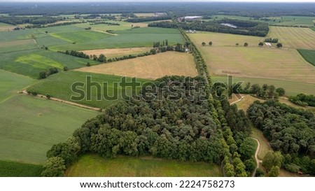 Land or landscape of green field in aerial view. Include agriculture farm, house building, village. That real estate or property. Plot of land for housing subdivision, development, sale or investment