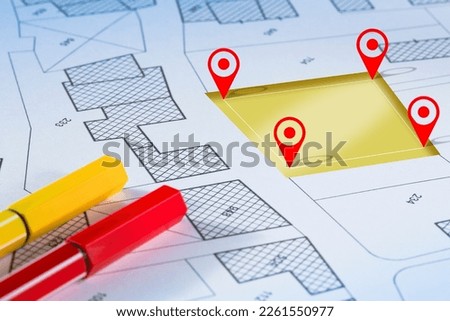 Land management concept with an imaginary cadastral map of territory with a vacant land available for sale or building construction
