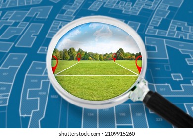Land management with an imaginary cadastral map of territory with a vacant land available for sale or building construction - Concept seen through a magnifying glass  - Shutterstock ID 2109915260