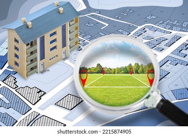 Land Management With An Imaginary Cadastral Map Of Territory With A Vacant Land Available For Sale Or Building Construction - Concept Seen Through A Magnifying Glass 