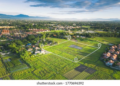 Land plot in aerial view. Include landscape, real estate, green field, agricultural plant, pin location icon. For housing subdivision, residential, development, owned, sale, rent, buy or investment.