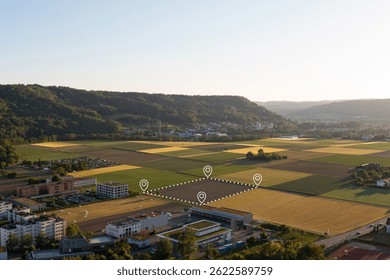 Land plot in aerial view. Include landscape, real estate, green field, crop, agricultural plant.Tract of land for housing subdivision. Aerial view of land and positioning point area.