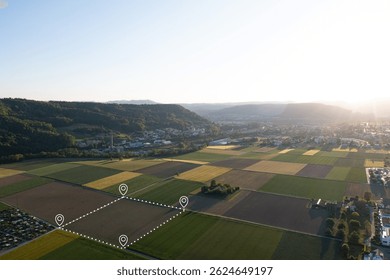 Land plot in aerial view. Include landscape, real estate, green field, crop, agricultural plant.Tract of land for housing subdivision. Aerial view of land and positioning point area.