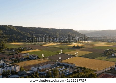 Land plot in aerial view. Include landscape, real estate, green field, crop, agricultural plant.Tract of land for housing subdivision. Aerial view of land and positioning point area.