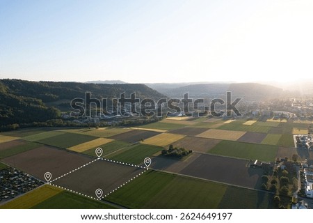 Land plot in aerial view. Include landscape, real estate, green field, crop, agricultural plant.Tract of land for housing subdivision. Aerial view of land and positioning point area.