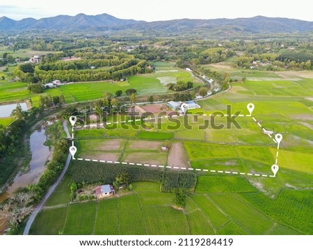 Land plot in aerial view, Top view land green field agriculture plant with pins, pin location icon for housing subdivision residential development owned sale rent buy or investment countryside suburbs